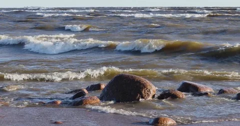 Waves Wash The Sandy Beach And Large Stones And Boulders. Stock-Footage 111418325