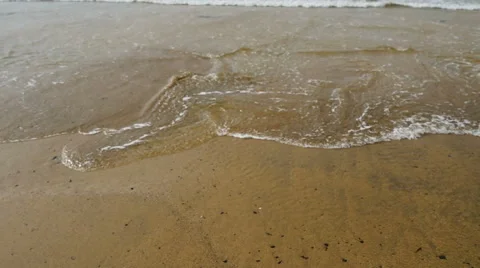 Waves wash to sandy beach, slow motion Video stock 56082141