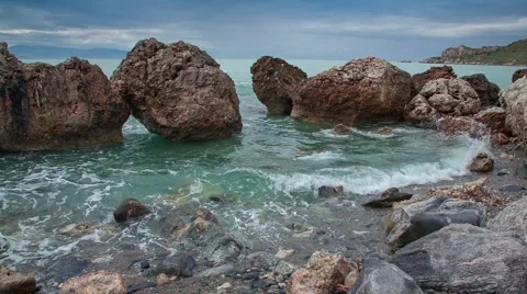 Waves washed coastal stones at spring day Stock Footage 48388726