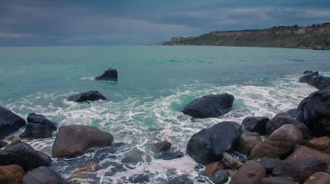 Waves washed coastal stones at spring day Stock Footage 58590553