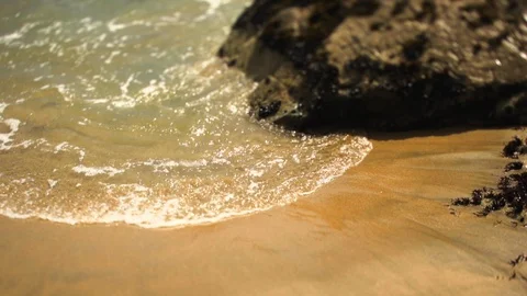 Waves washing ashore at a beach. Video stock 88367866