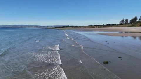 Waves Washing Ashore on Sandy Beach in 4K Stockbeeldmateriaal 332943602