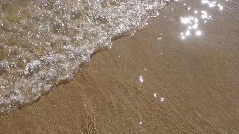 Waves washing onto beach Stock Footage 160066770