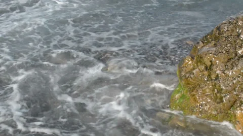 Waves washing big stone Stock Footage 36756257