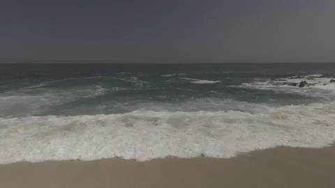 Waves washing over the beach Stock Footage 279774104