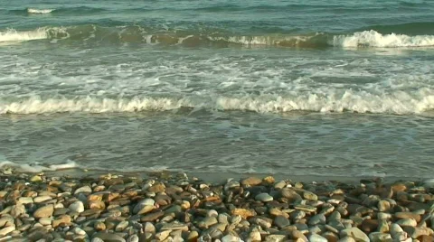 Waves washing onto pebble beach Stock Footage 85588