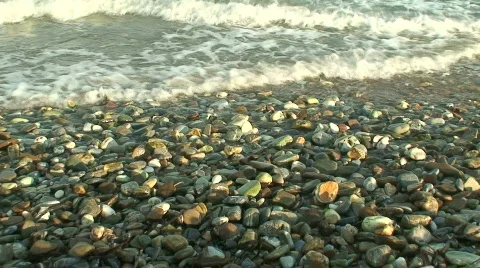Waves washing onto pebble beach Stock Footage 85590