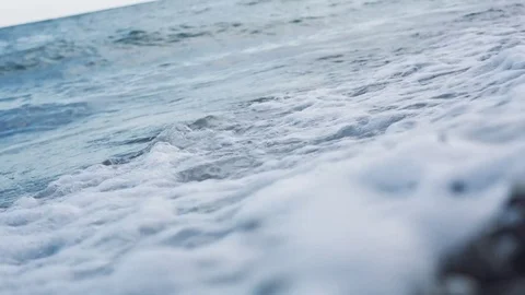 Waves washing the pebble beach. Sea waves washes pebble beach. Stock Footage