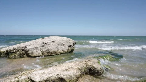 Waves washing the rock Video stock 112889779
