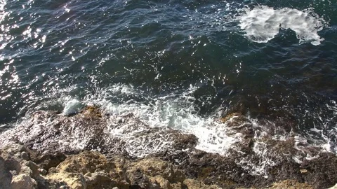 Waves washing the rocks Stock Footage 79429431