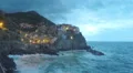 Waves washing rocks near beautiful Positano village in Italy, storm timelapse 4k or 4k+ Resolution