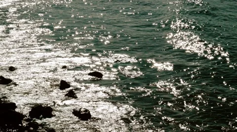 Waves washing onto a sandy beach Stock Footage 54712577