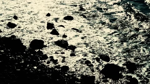 Waves washing onto a sandy beach Stock Footage 54712697