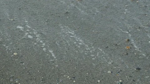 Waves washing onto a sandy beach Stock Footage 54712967