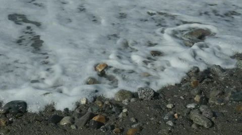 Waves washing onto a sandy beach Stock Footage 54713015