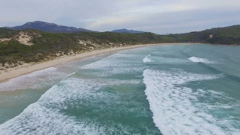 Waves washing onto a sandy beach Video stock 73020182