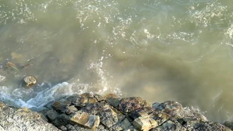 Waves of water hit the edge of the lake Stock Footage 280688609