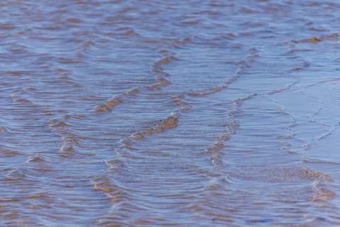 Waves in the water in a river Stock Photos