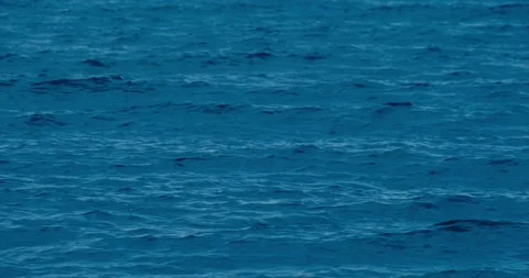 Waves on the water surface in the blue sea Stock Footage 133720319
