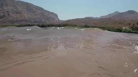 Waves of water surface of Colorado River Grand Canyon Arizona Stock Footage 77652693