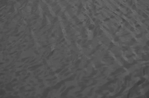 Waves on the water surface at night. Stock Photos