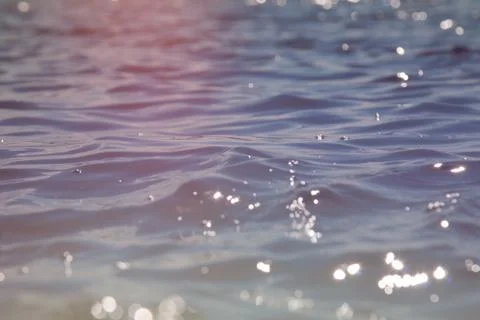 Waves on the water surface. Stock Photos