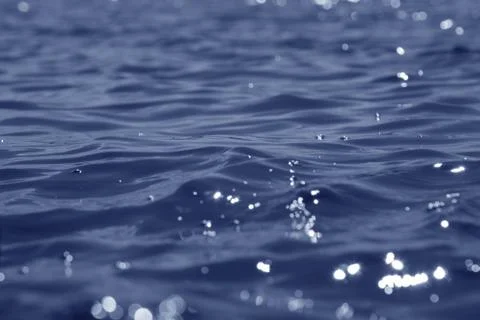 Waves on the water surface. Stock Photos