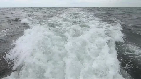 Waves of water trailing at the back of boat Stock Footage 155179242