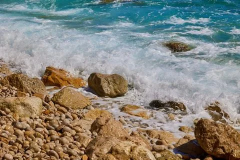 Waves waves crashing against rocks on the shores of the Mediterranean Sea Stock Photos