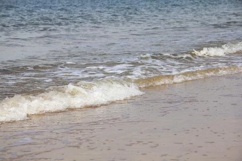 Waves of white foam Crown roll over the sea surface Stock Photos