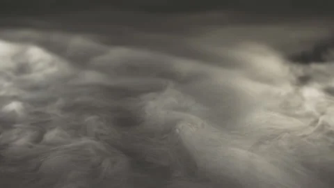 Waves of white smoke on a black surface Stock Footage 221943433