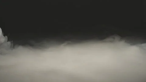 Waves of white smoke on a black surface Stock Footage 223200758