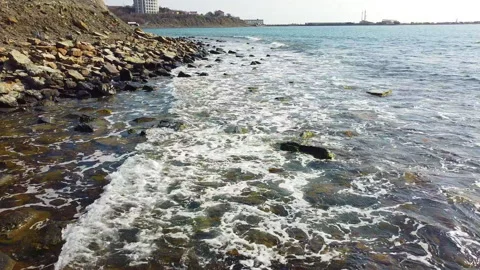 Waves on a wild beach outside the city. Stock Footage 151949451