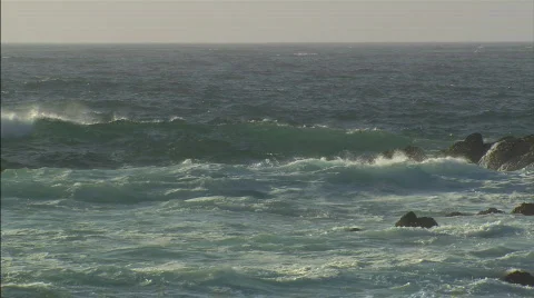 WavesCrashAgainstRocks Stock Footage 400844