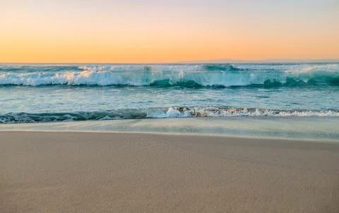 Wavey Beach at Sunset Stock Photos