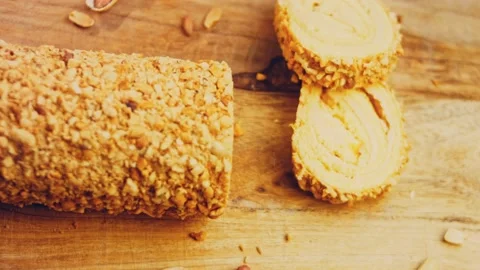 Waviness effect of Peanut roll cake. In the background are a few pieces of cake Stock Footage 231147493