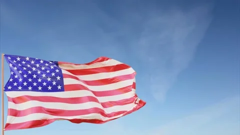Waving american flag on flagpole in slow motion, close up - blue sky Stock Footage 148997513