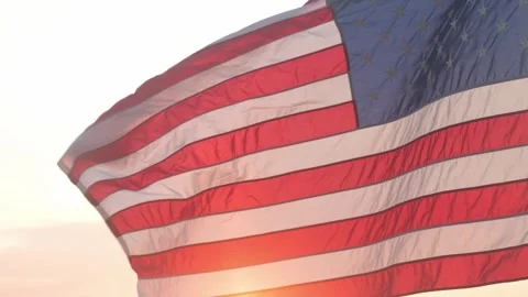 Waving American Flag in Sunlight During Sunset Video stock 294795095