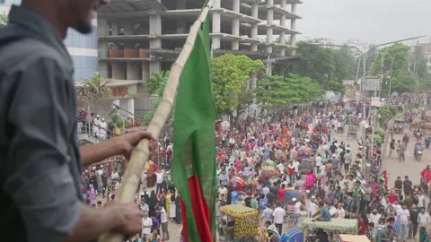 Waving the Bangladeshi flag over the crowd and celebrating their victory Stock Footage 281280153