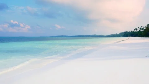 Waving caribbean sea turquoise water white sand beach sunny tropical coastline i Stock Footage