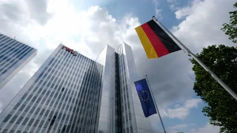 Waving EU and german flags against the RWI4 building in Düsseldorf, Germany Stock Footage 157313925