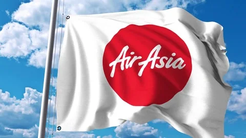 Waving flag with AirAsia logo. 4K editorial clip Stock Footage