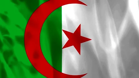 Waving flag of Algeria featuring a red crescent and star on green and white.. Video stock 343582065