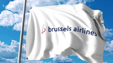 Waving flag with Brussels Airlines logo. 4K editorial clip Stock Footage