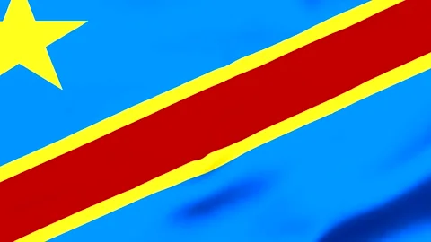 Waving flag of Democratic Republic of Congo with blue background Video stock 343573520