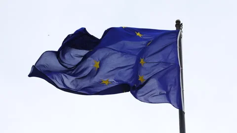 Waving flag of Europe during cloud day in some building. Stock Footage 287857660