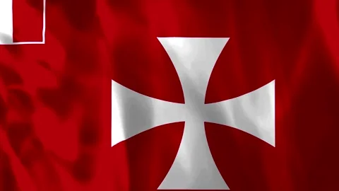 A waving flag featuring a white Maltese cross on a red background with silk.. Видео 343581746