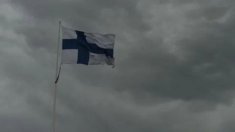 Waving flag of Finland against a cloudy sky Stock Footage 194379853