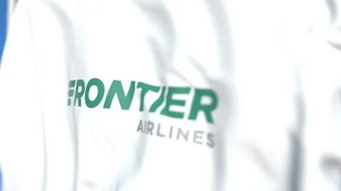 Waving flag with Frontier Airlines logo, close-up. Editorial 3D rendering Stock Illustration