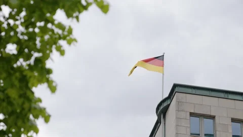Waving flag of Germany on top of a building Stock Footage 158070322